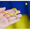 Браслет "Тризуб. Герб України". Колір - яскраво жовтий. Основа колір срібло